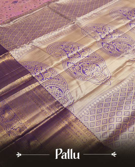 Pink colour and Antique gold Zari Tissue Brocade Saree features intricate blue colourred floral Motifs on body and a navy blue colour traditional border & pallu with floral patterns, paired with matching blouse