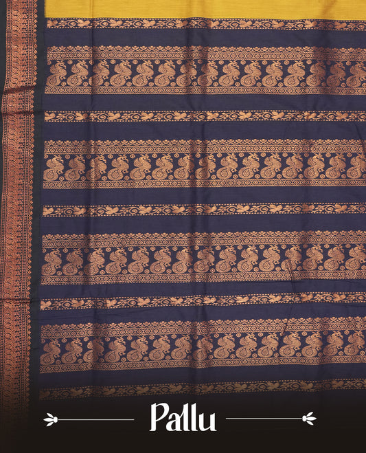 Mustard yellow colour Kalyani Cotton saree with subtle zari woven motifs all over, paired with a contrasting navy blue rich copper zari border & peacock motifs on pallu & Comes with a matching blouse piece.