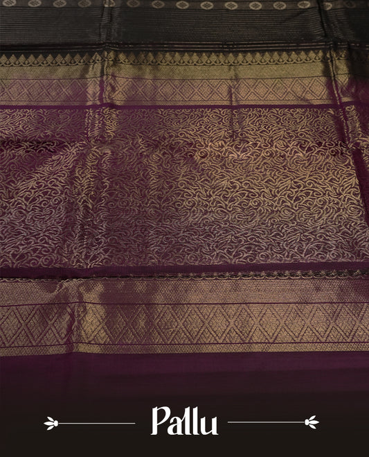 Black colour pure Handloom cotton saree featuring delicate rose gold zari stripes and motifs, paired with a rich purple border, perfect for graceful occasions & Comes with matching blouse.