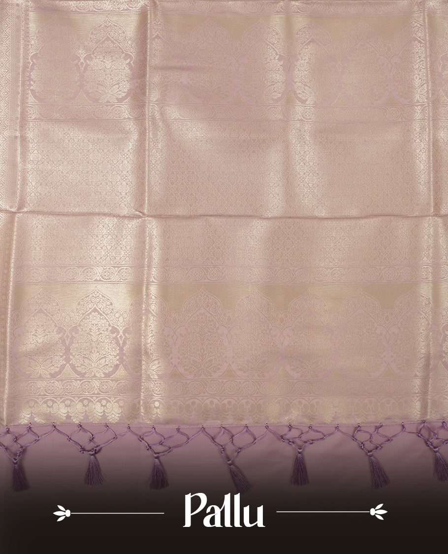 Lavender colour semi soft silk saree featuring an all-over woven leaf pattern in gold colour , finished with a matching border adorned with detailed paisley and floral motifs, and a matching blouse piece.