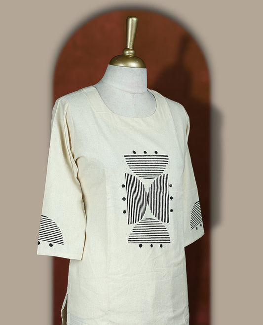 Cream colour cotton coord set with bold geometric prints and a pop of black, Features a round neck kurta with 3/4th sleeves and matching straight pants.