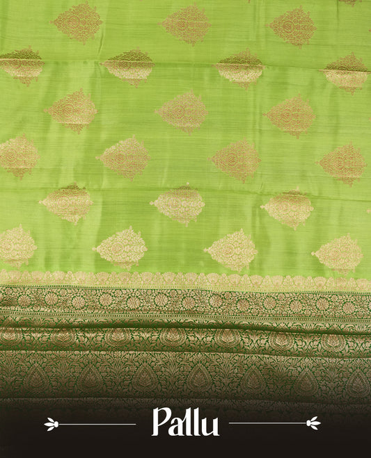 Parrot Green Colour Banaras Soft Silk Saree with Gold Zari Textured Diamond-Shaped Buttas, Simple Decorative Pallu Border, Grand Pallu with Ornate Circular and Floral Motifs in Forest Green and Gold Tones, and Matching Forest Green Blouse.