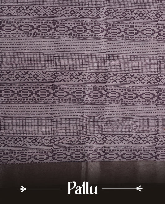 Purple colour chanderi silk saree featuring geometric print pattern across body, with contrast Blue colour border with zari pattern and paired with matching blouse.