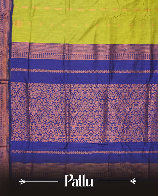 Lemon green colour Kalyani cotton saree with contrast royal blue border adorned with intricate copper zari weaving & Paired with matching blouse.