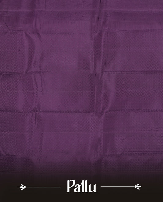 Dark purple  colour semi soft silk saree featuring a self coloured textured patterned body, complemented by self coloured motifes on pallu & border and a matching blouse piece.