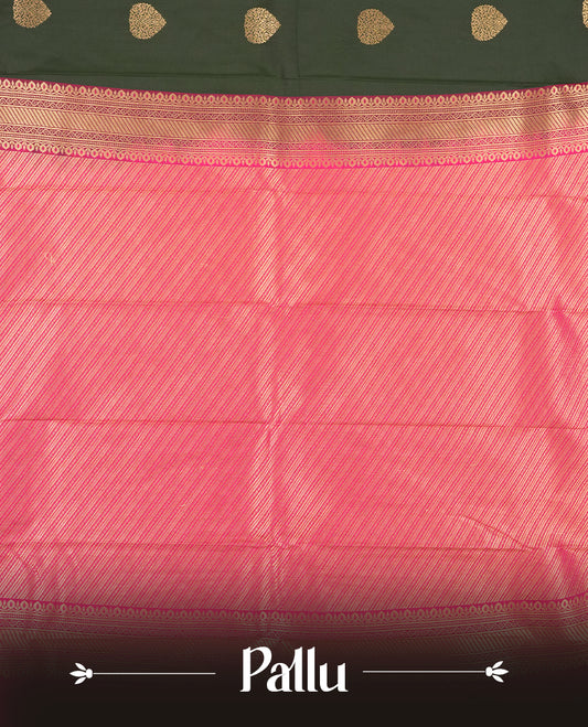 Dark green colour Semi Silk Saree with gold zari patterns on the body, paired with a contrasting rani pink colour traditional pallu and border, and a matching blouse piece.