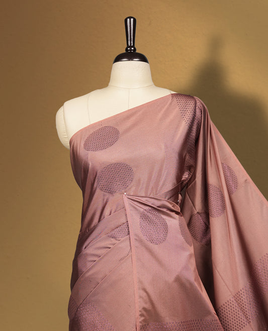 Mavue brown colour semi soft silk saree, beautifully designed with woven circular motifs & The look is enhanced by a rich contrast dark chocolate brown border and pallu, paired with a matching blouse.