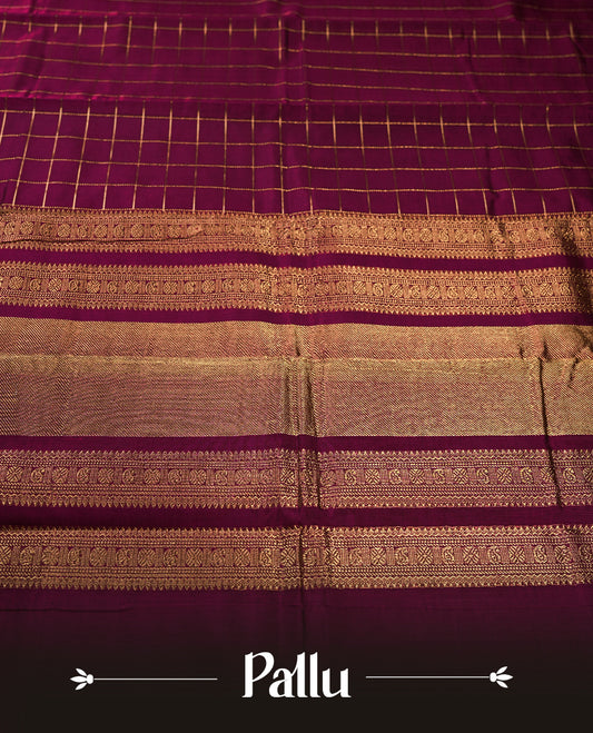 Deep Magenta colour pure Kanchi cotton saree featuring with delicate golden checks on body, paired with a contrasting deep maroon zari woven border & Includes a matching blouse piece for a complete look.