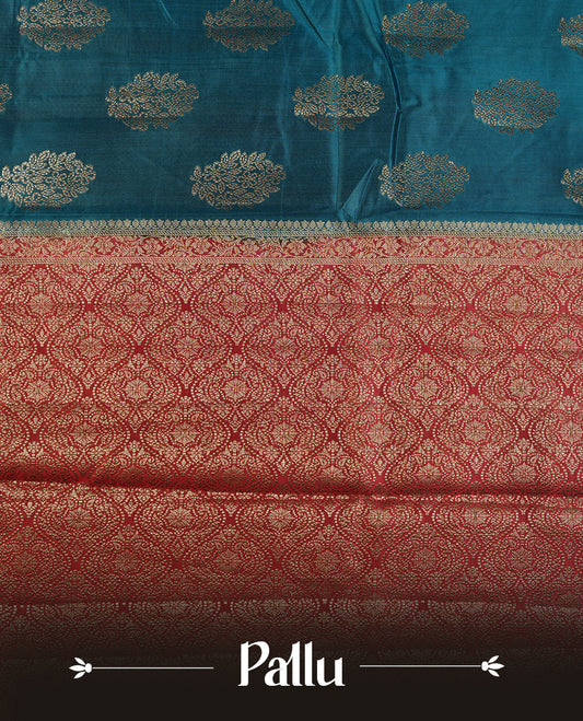 Blue colour Pure tussar Banarasi saree featuring Gold zari motifs on body, by contrast deep red colour gold zari border border, and a matching blouse piece.