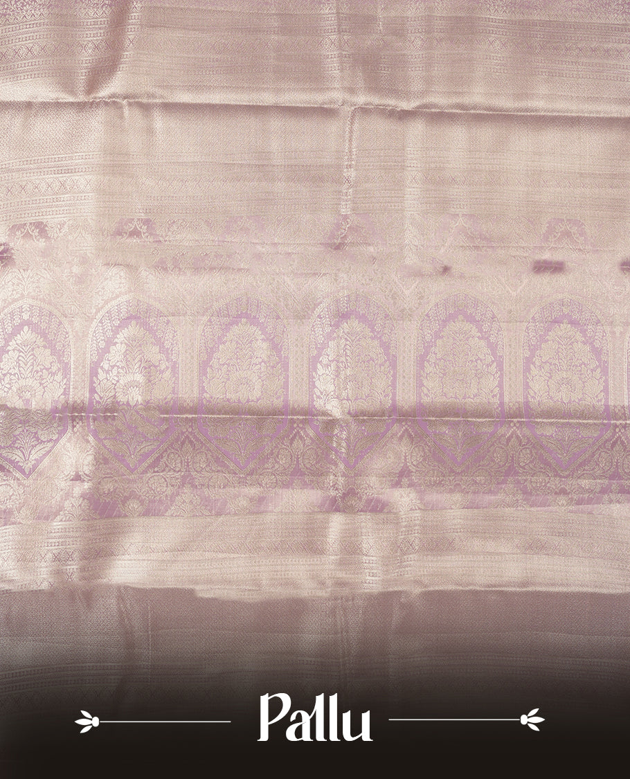 Light lavender colour and silver Zari Tissue Brocade Saree features intricate floral Motifs on body and dark pink colour contrast with traditional border & pallu, paired with matching blouse