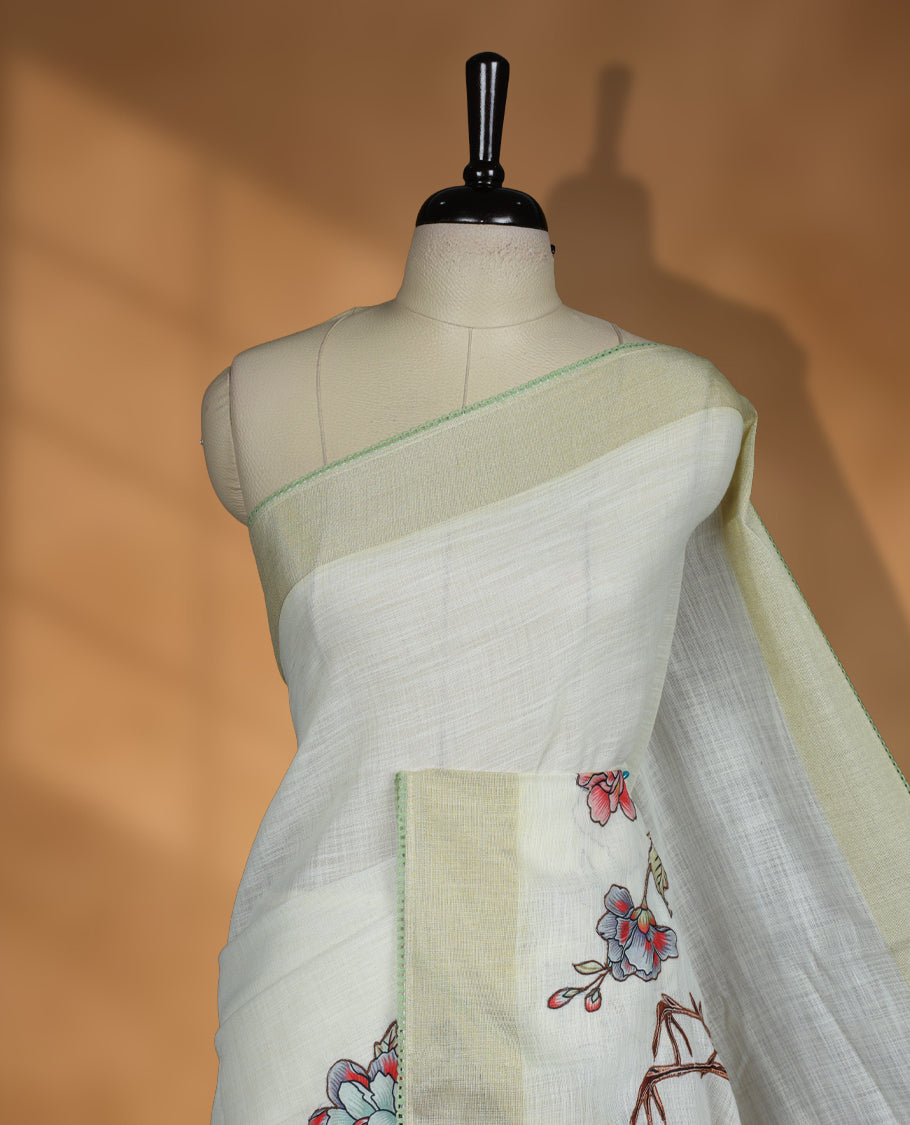Cream colour cotton linen silk saree featuring Floral  & brids printed pattern on body, golden simple border with green colour pallu and comes with a matching blouse