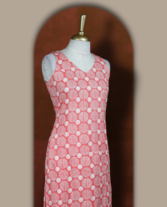 Peach colour cotton cord set with geometric off white prints, featuring a straight kurta with stylish sleeveless with side slits, paired with coordinated bottoms.