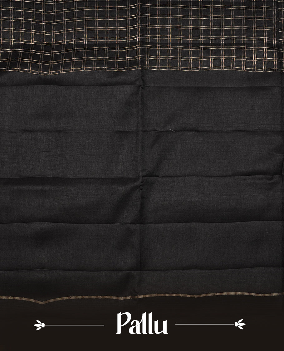 Black colour semi Tussar saree highlights gold zari check pattern across body,  border, pallu and paired with matching blouse piece.