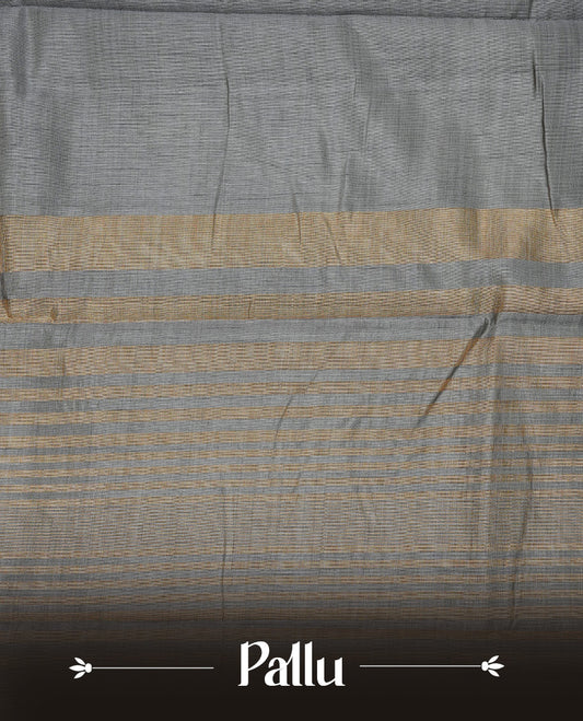 Gray colour semi tussar silk saree featuring an elegant plain body with traditional gold zari detailed border for a refined look. Comes paired with a matching blouse piece.