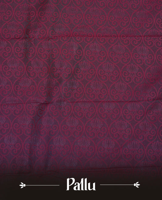 Maroon colour Semi silk saree Featuring selfcolour zari motifs on body, complemented by contrast Green colour with gold zari border, paired with matching blouse piece.
