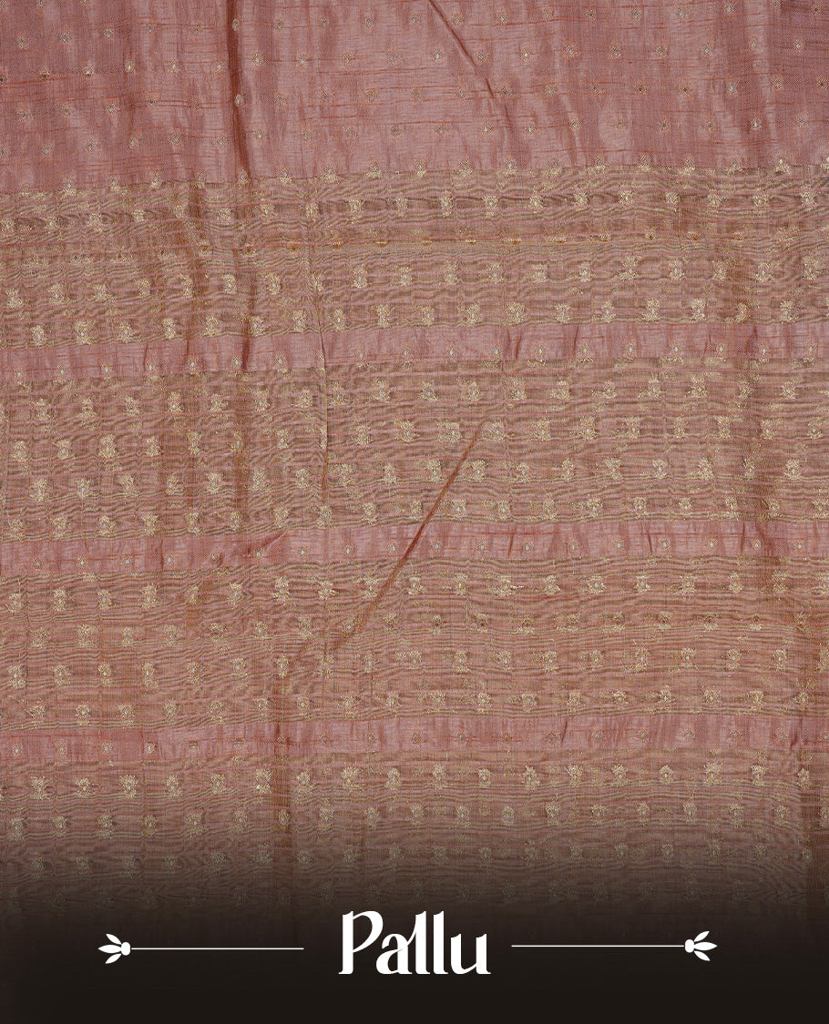 Dusty Rose colour semi tussar silk saree featuring gold zari dot motifs all over the body, highlighted by a self colour border with intricate gold zari temple patterns. Comes paired with a matching blouse piece.