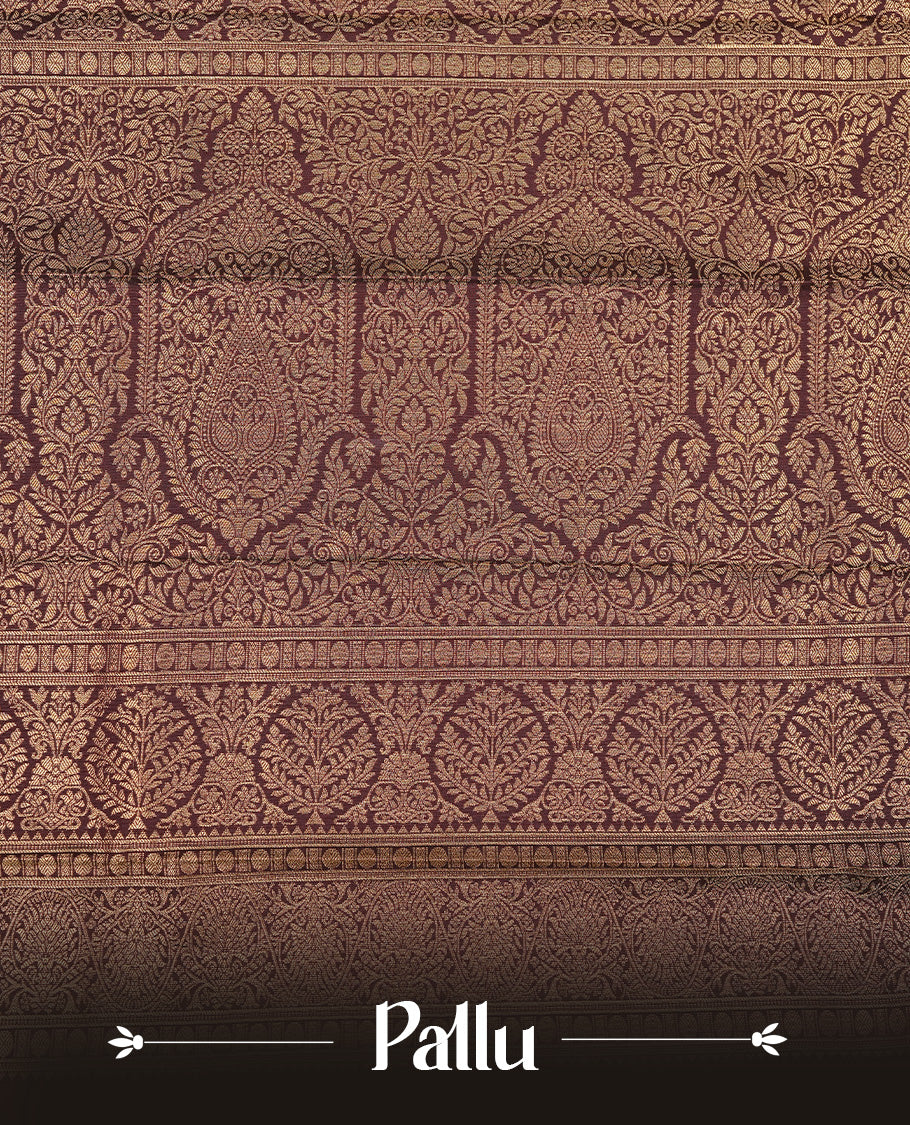 Dark chocolate colour Semi silk saree Featuring gold zari motifs on body, complemented by Self colour with gold zari border, paired with matching blouse piece.