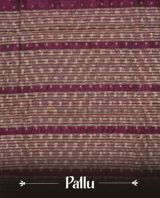 Chocolate colour semi tussar silk saree featuring gold zari dot motifs all over the body, highlighted by a self colour border with intricate gold zari temple patterns. Comes paired with a matching blouse piece.
