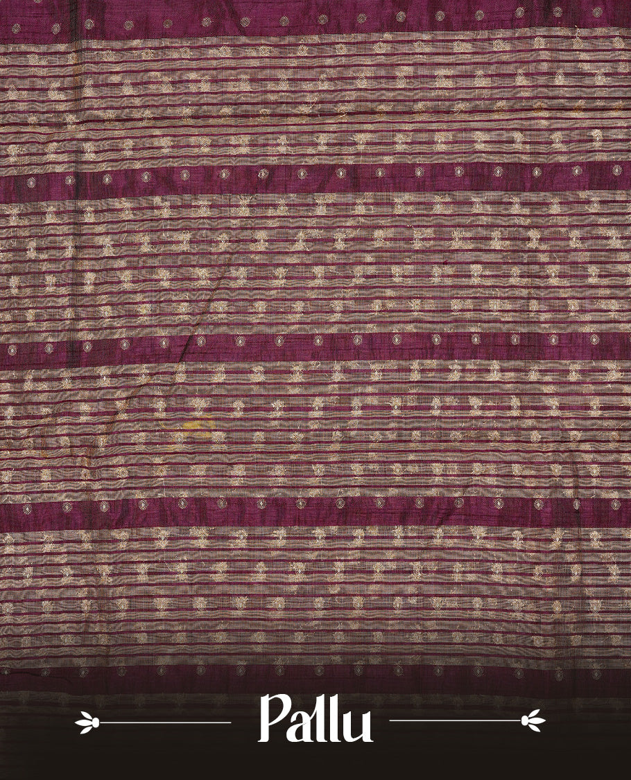 Chocolate colour semi tussar silk saree featuring gold zari dot motifs all over the body, highlighted by a self colour border with intricate gold zari temple patterns. Comes paired with a matching blouse piece.