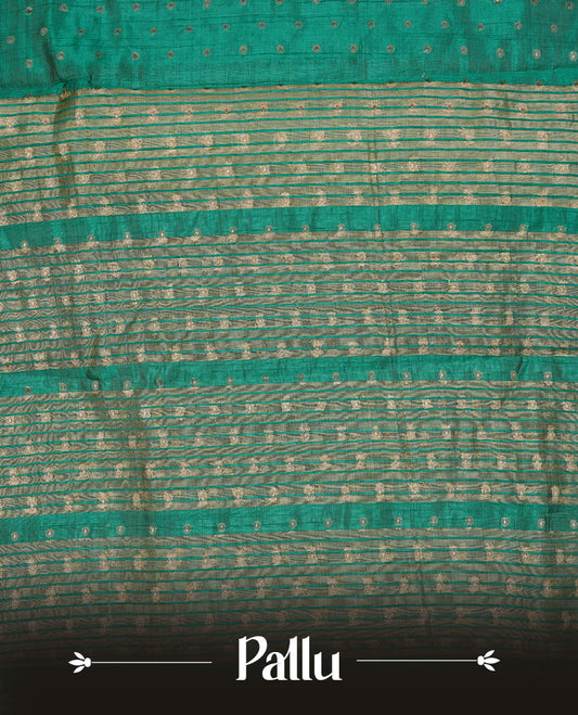 Cadmium green colour semi tussar silk saree featuring gold zari dot motifs all over the body, highlighted by a self colour border with intricate gold zari temple patterns. Comes paired with a matching blouse piece.