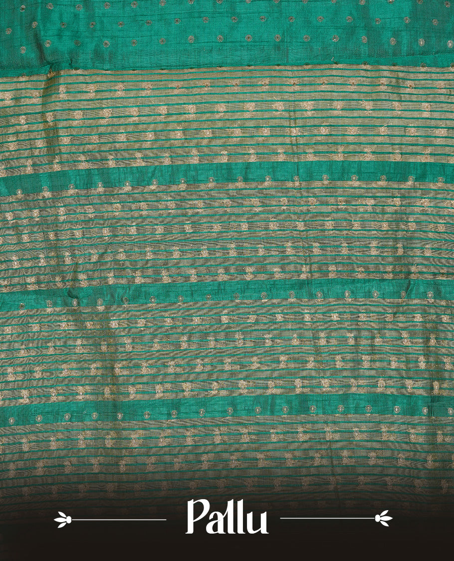 Cadmium green colour semi tussar silk saree featuring gold zari dot motifs all over the body, highlighted by a self colour border with intricate gold zari temple patterns. Comes paired with a matching blouse piece.