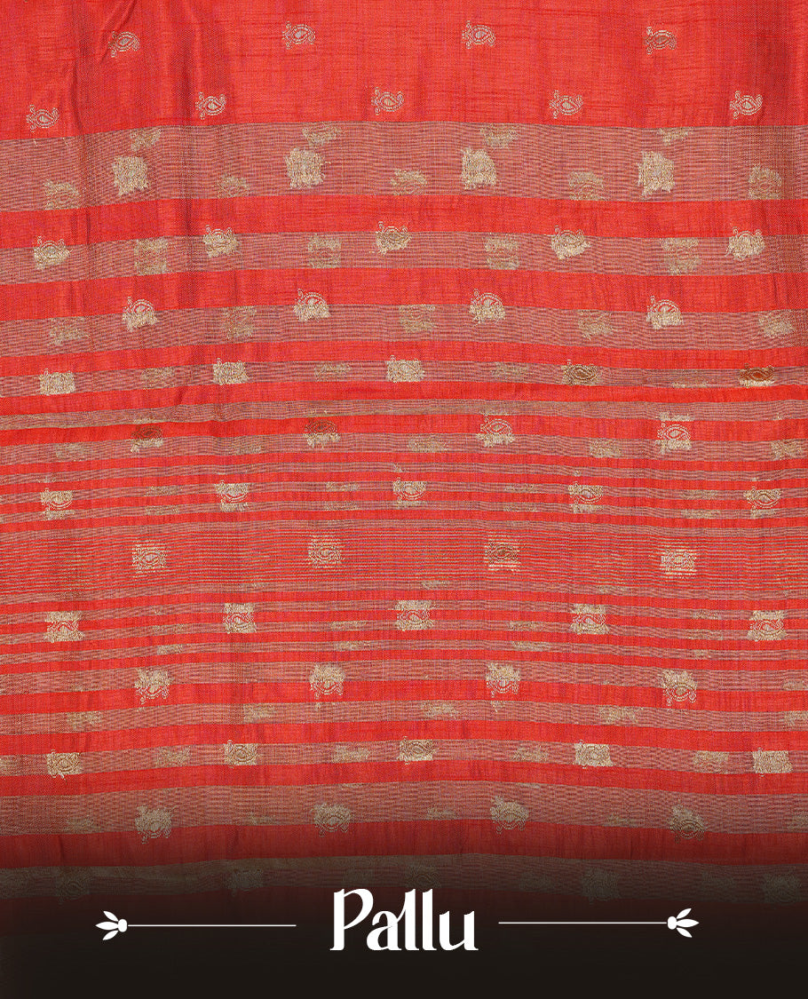 Red colour semi tussar silk saree featuring small gold zari mango motifs across the body, enhanced with a self colour border showcasing elegant gold zari mango patterns. Paired with a matching blouse piece.