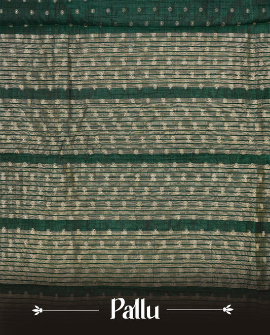Green colour semi tussar silk saree featuring gold zari dot motifs all over the body, highlighted by a self colour border with intricate gold zari temple patterns. Comes paired with a matching blouse piece.