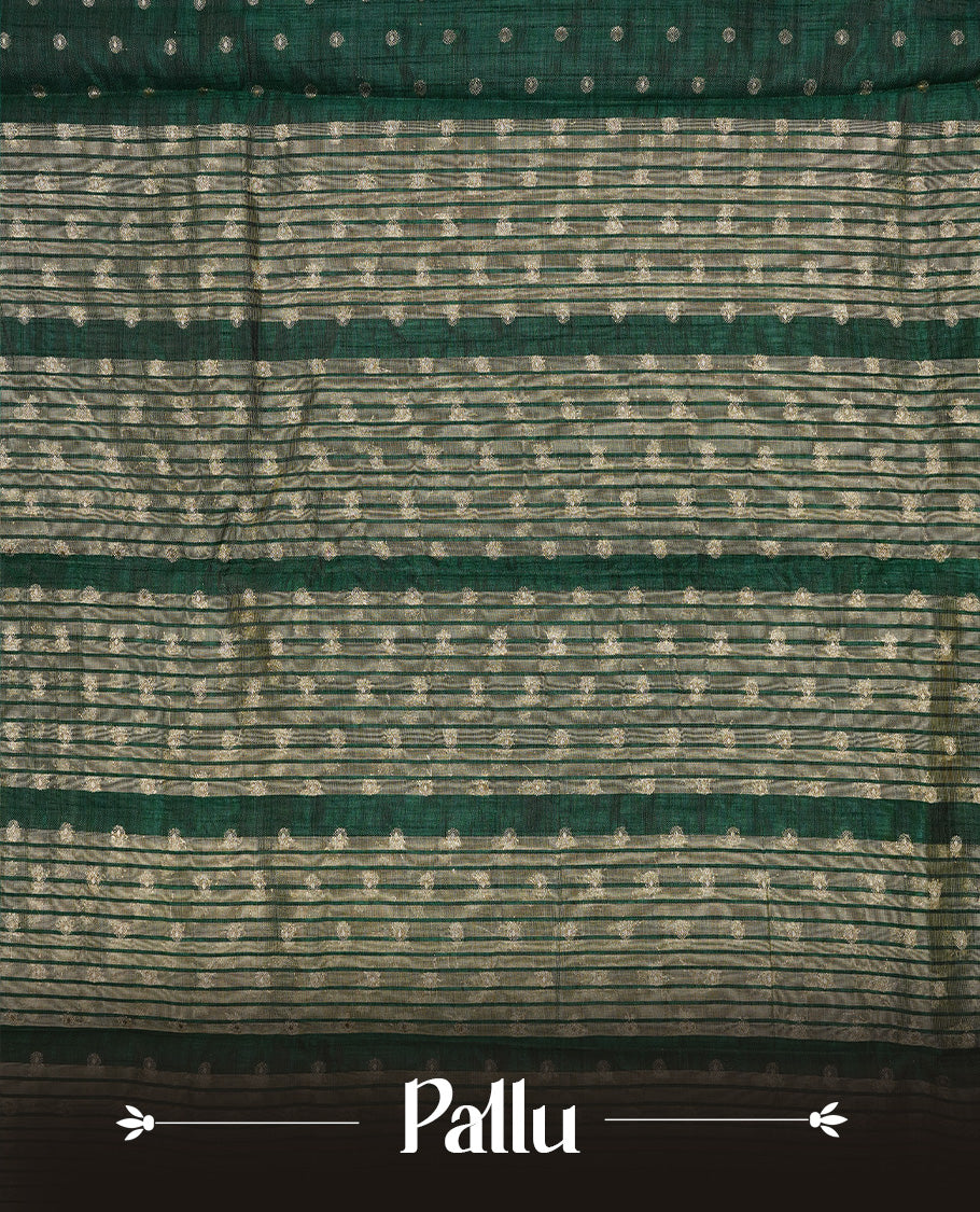 Green colour semi tussar silk saree featuring gold zari dot motifs all over the body, highlighted by a self colour border with intricate gold zari temple patterns. Comes paired with a matching blouse piece.