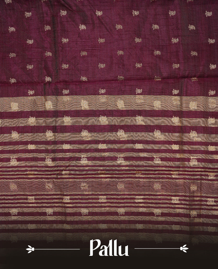 Chocolate brown colour semi tussar silk saree featuring small gold zari mango motifs across the body, enhanced with a self colour border showcasing elegant gold zari mango patterns. Paired with a matching blouse piece.
