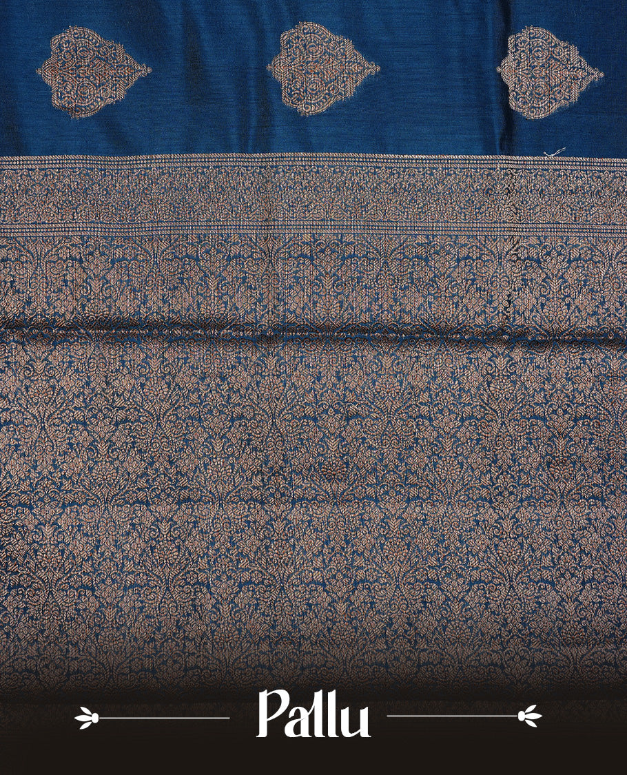 Teal Colour Pure Banaras Soft Silk saree featuring Antique Zari buttas in body, complemented by zari work on self colour border, paired with matching Blouse Piece.