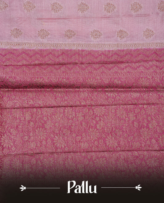 Pink Colour Tussar silk saree featuring Antique Zari motifs on body, Finished with contrast Magenta colour Zigzag zari pattern border, paired with matching blouse piece.