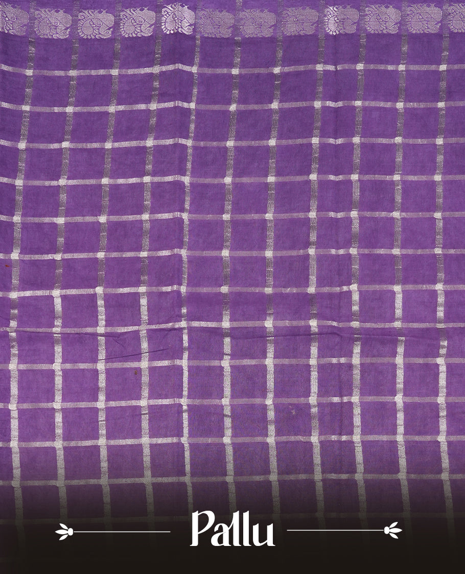 Purple colour Chettinad cotton saree featuring silver checked patterns on the body, accentuated with elegant silver peacock motifs along the border & Comes with a matching blouse piece.