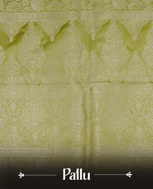 Olive colour Mulberry silk saree featuring light gold small buttas & big motifs onbody, complemented by self colour with Light gold zari floral Border, comes with matching blouse piece.