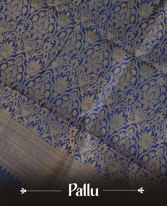 Cream Colour Semi Soft Silk Saree Featuring Gold zari Patter On Body, Highlighted  by contrast Dark Blue border with Gold zari, paired with matching blouse piece.
