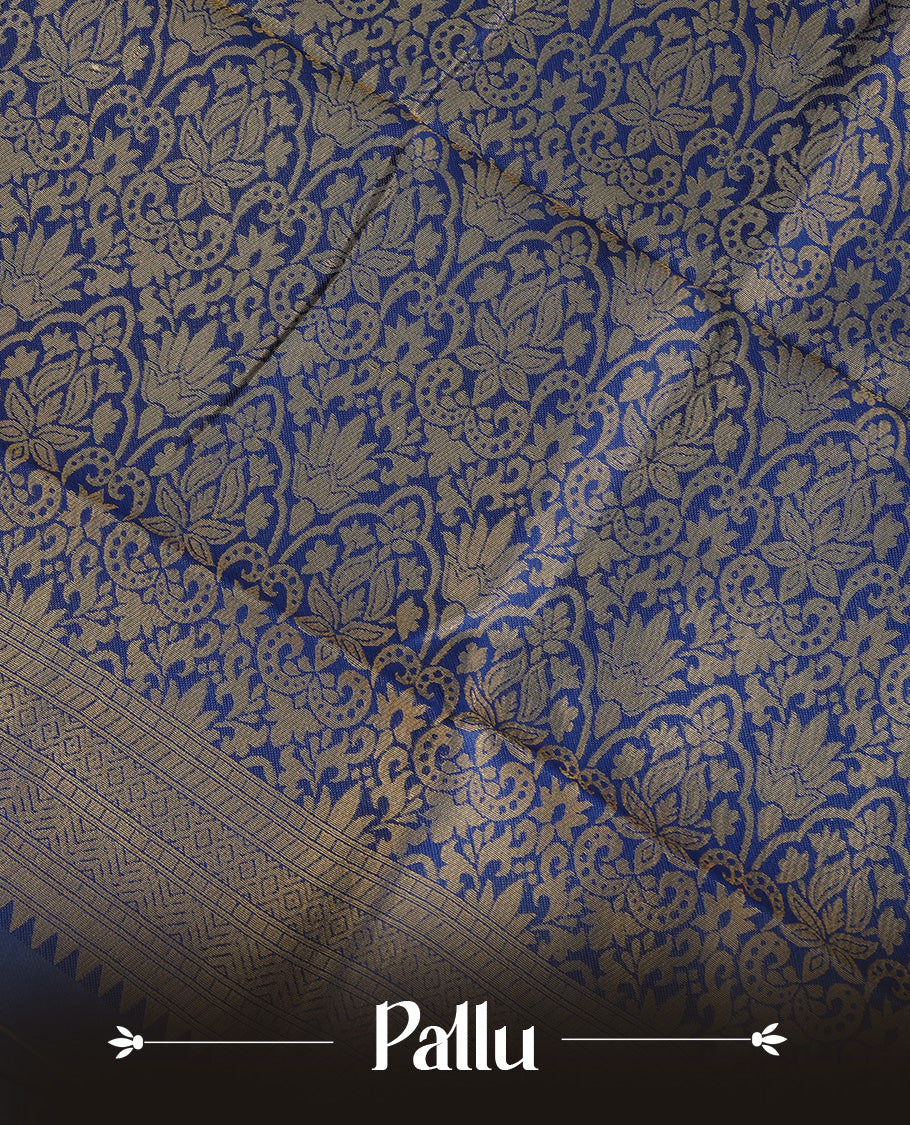 Cream Colour Semi Soft Silk Saree Featuring Gold zari Patter On Body, Highlighted  by contrast Dark Blue border with Gold zari, paired with matching blouse piece.