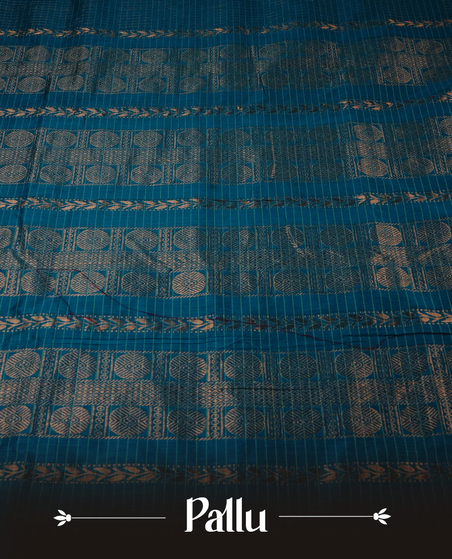 Peacock Blue colour Kalyani cotton saree featuring Gold zari checks on body, enhanced with zari border and grand zari pallu, comes with self colour blouse piece.