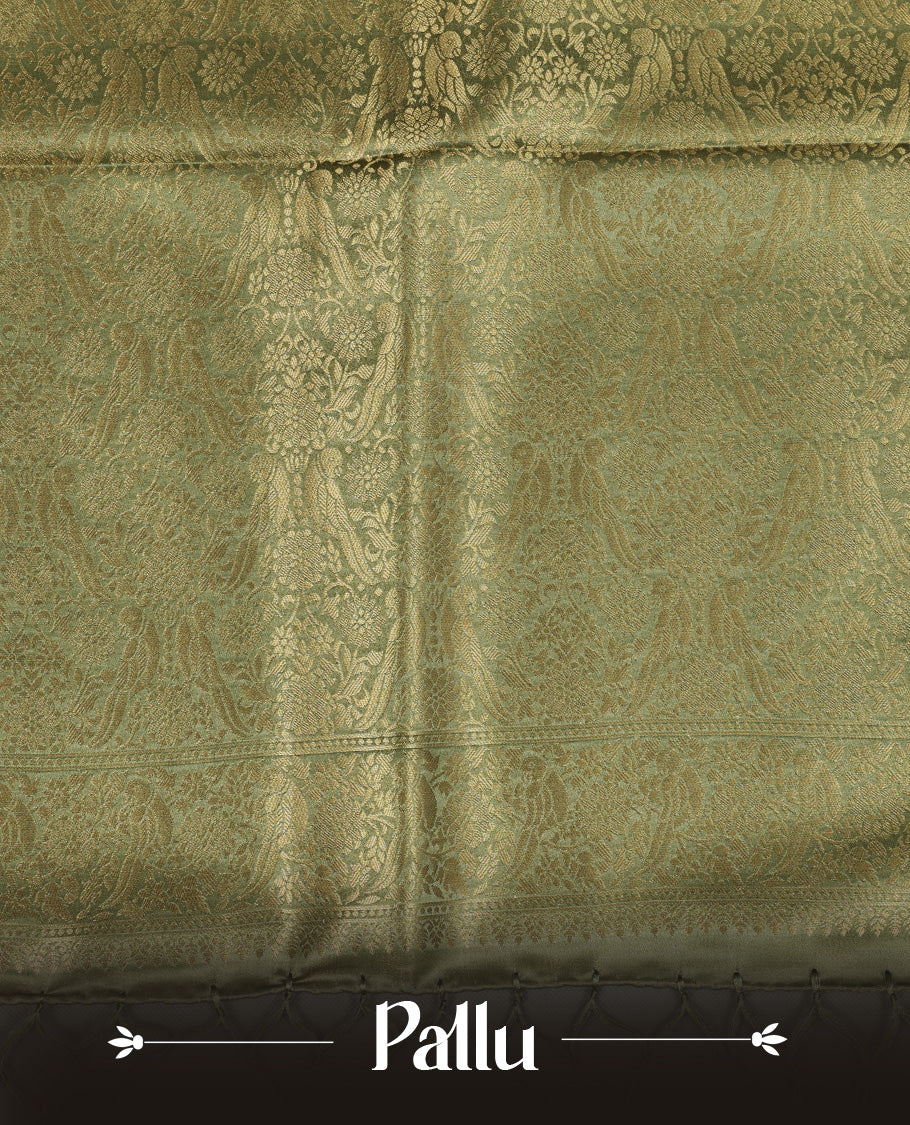 Pastel green colour Mulberry silk saree featuring Gold zari bird motifs on body, complemented by self colour with gold zari border, comes with matching blouse piece.