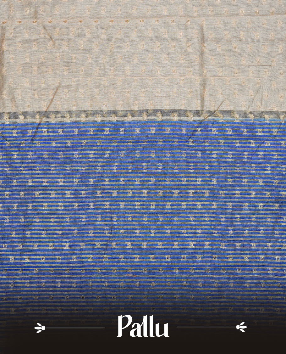 Cream colour Semi Tussar silk saree featuring an Gold zari motifs on body, accentuated by a contrast Blue border adorned with intricate gold zari work, paired with a matching blouse piece.