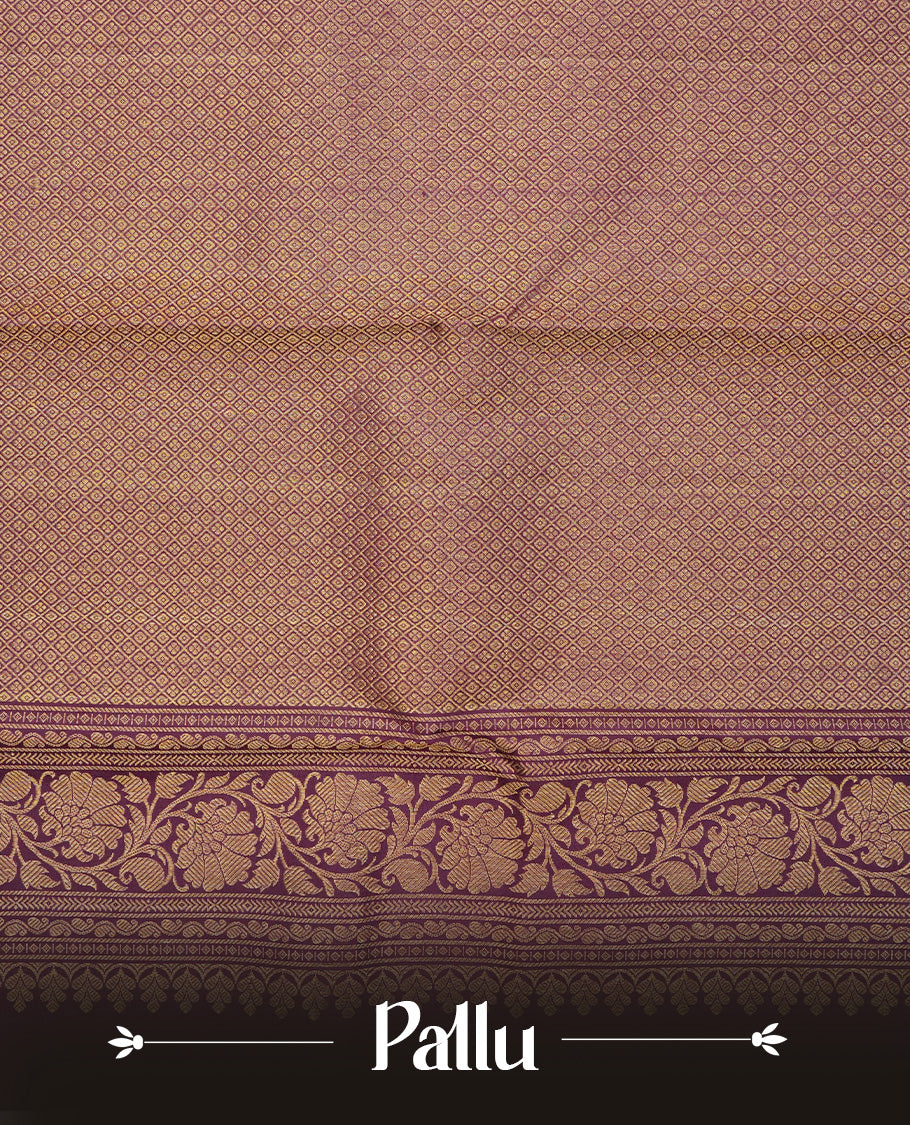 Pinkish grey colour traditional kancheepuram silk saree featuring gold zari chakram & Peacock motifs on body, complemented by contrast Purple colour with Gold zari border, comes with matching blouse piece.