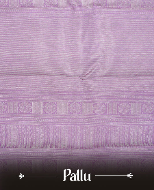 Lavender colour pure wedding silk saree featuring Silver zari Floral kodi pattern on body, complemented by self colour with traditional border, comes with matching blouse piece.