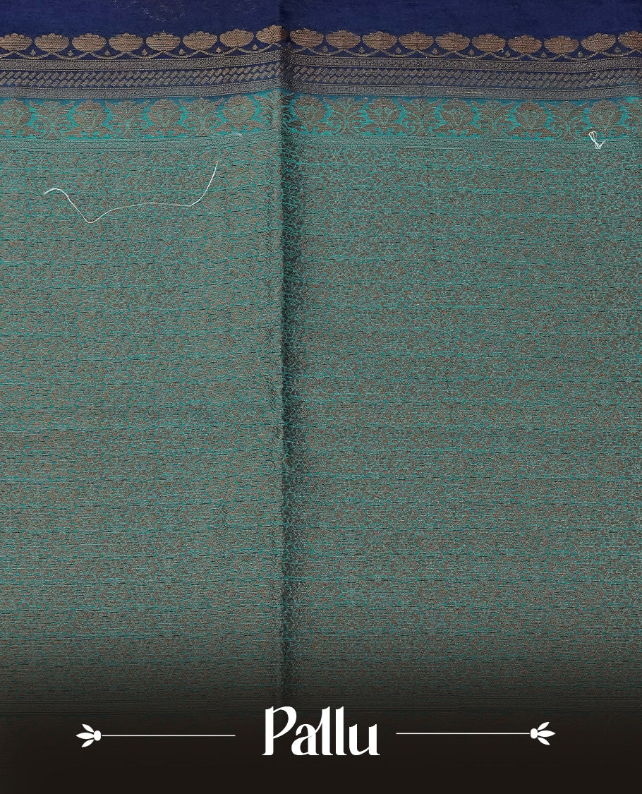 Navy blue colour semi linen saree with elegant gold zari floral motifs across the body, complemented by a contrast peacock green with grand gold zari pallu and a borderless design, paired with a matching blouse piece.