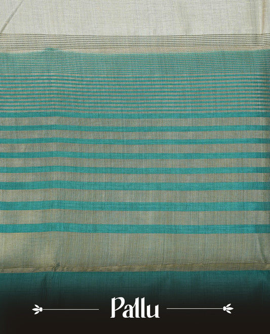 Light gold Colour Tussar saree featuring elegant plain body, complemented by contrast Teal colour with zari work border, comes with matching blouse piece.