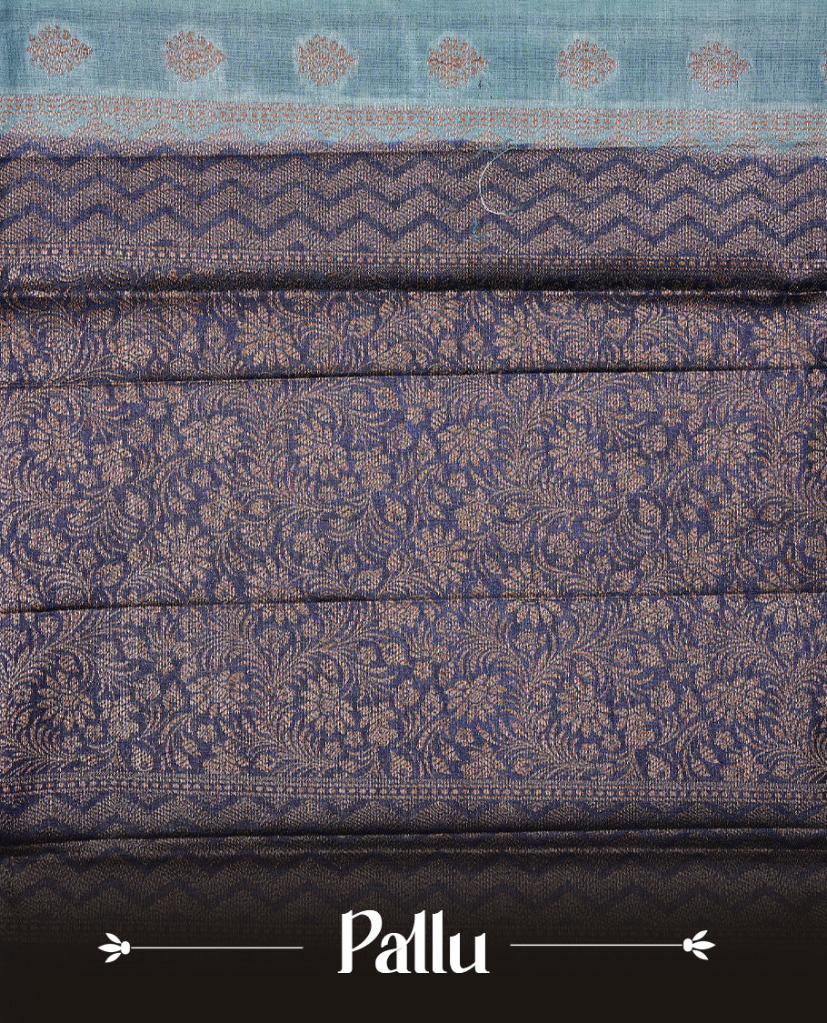 Aqua Blue Colour Tussar silk saree featuring Antique Zari motifs on body, Finished with contrast Blue colour Zigzag zari pattern border, paired with matching blouse piece.