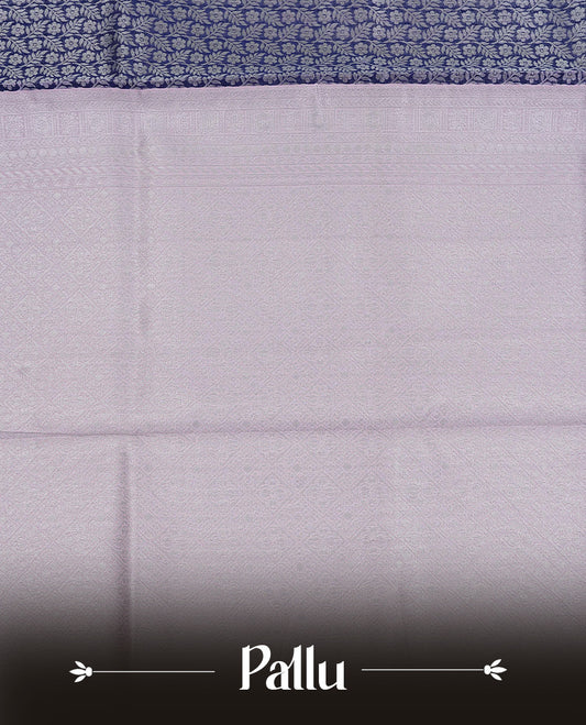 Navy blue colour semi silk saree featuring Silver zari pattern on body, complemented by contrast Pink colour with silver zari border, comes with matching blouse piece.