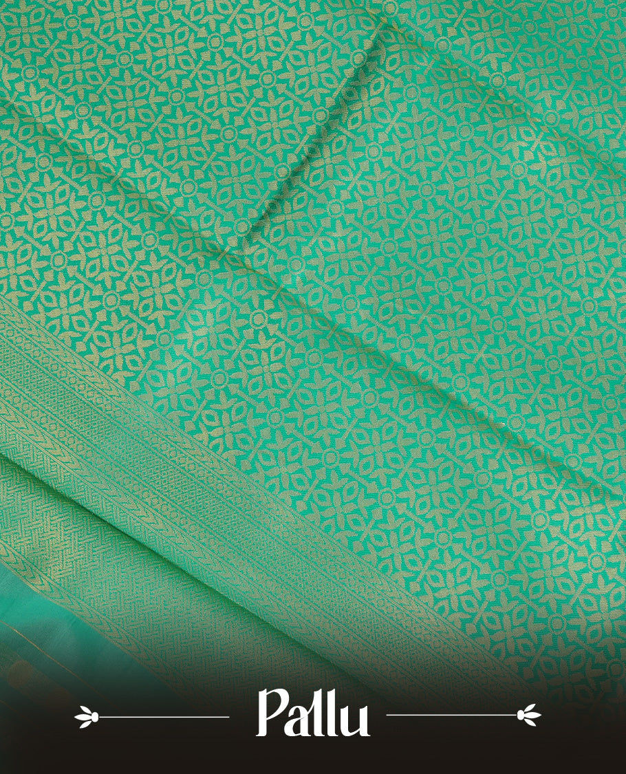 Cream Colour Semi Soft Silk Saree Featuring Gold zari Box With motifs Pattern On Body, Highlighted  by contrast Green border with Gold zari, paired with matching blouse piece.