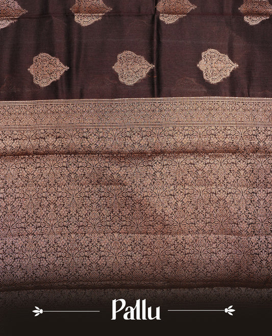Chocolate Brown Colour Pure Banaras Soft Silk saree featuring Antique Zari buttas in body, complemented by zari work on self colour border, paired with matching Blouse Piece.