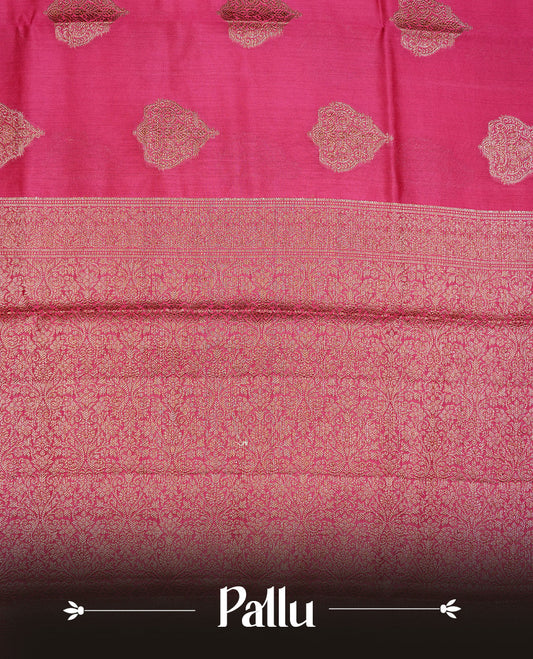 Magenta Colour Pure Banaras Soft Silk saree featuring Antique Zari buttas in body, complemented by zari work on self colour border, paired with matching Blouse Piece.