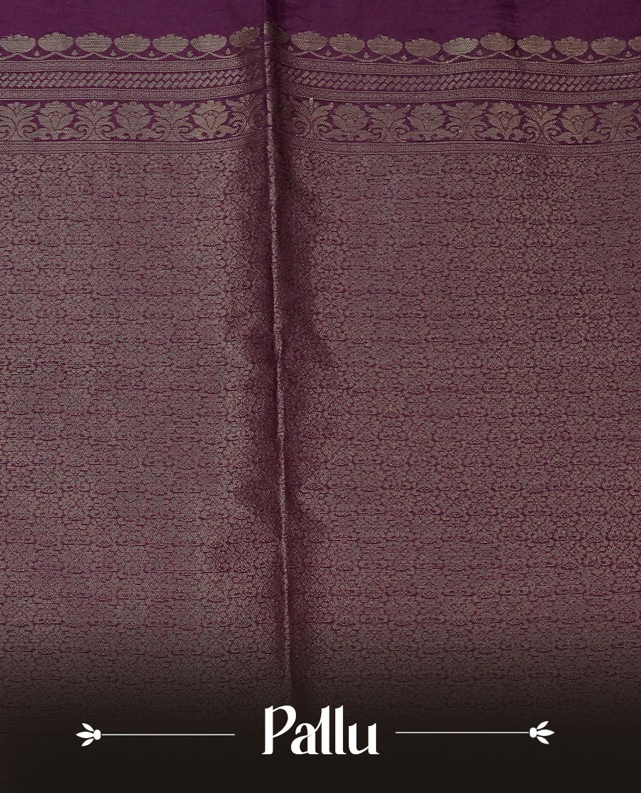 Deep Purple colour semi linen saree with elegant gold zari floral motifs across the body, complemented by a contrast colour with grand gold zari pallu and a borderless design, paired with a matching blouse piece.
