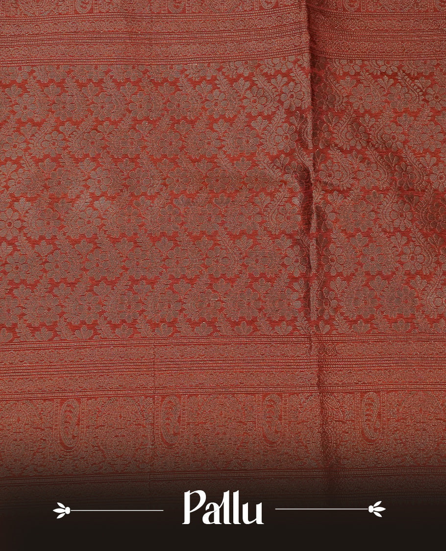 Brick red colour semi silk saree featuring Gold zari Leaf pattern on body, complemented by contrast  colour with Gold zari border, comes with matching blouse piece.
