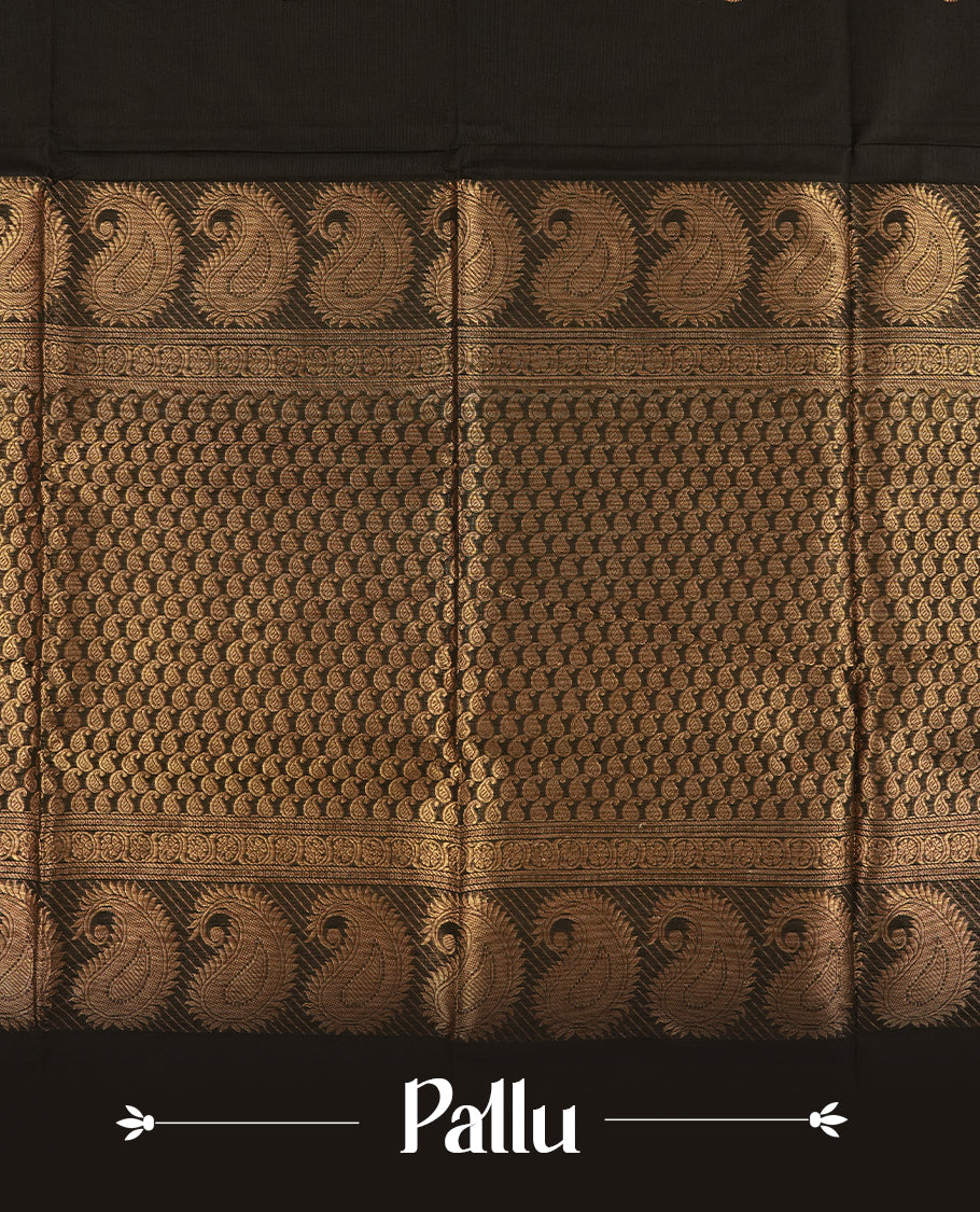 Black colour Chettinad cotton saree adorned with small woven motifs on the body, highlighted by a maroon border featuring intricate golden zari floral patterns and temple design & Comes with a matching blouse piece.